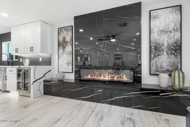 a kitchen with stainless steel appliances kitchen island granite countertop a sink and cabinets