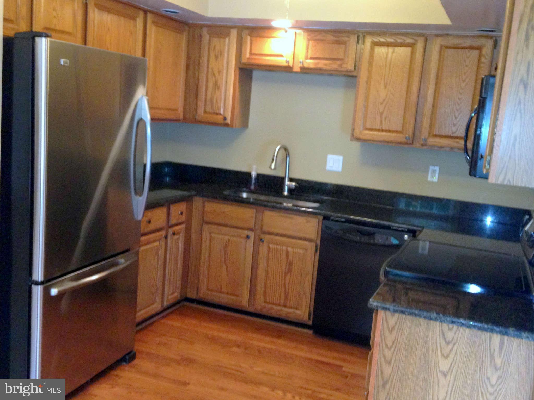 19225 Cross Ridge Drive Germantown, MD 20874 - Photo 6 of 15 New appliances granite counter wood floors