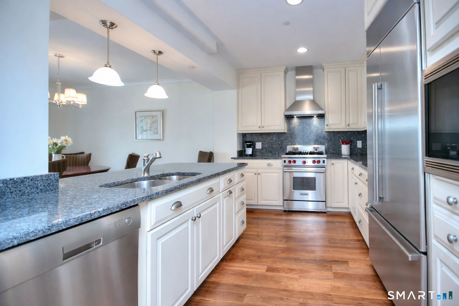 16 Hayestown Road, Unit C402 Danbury, CT 06811 - Photo 13 of 36 a large kitchen with stainless steel appliances kitchen island granite countertop a sink and cabinets
