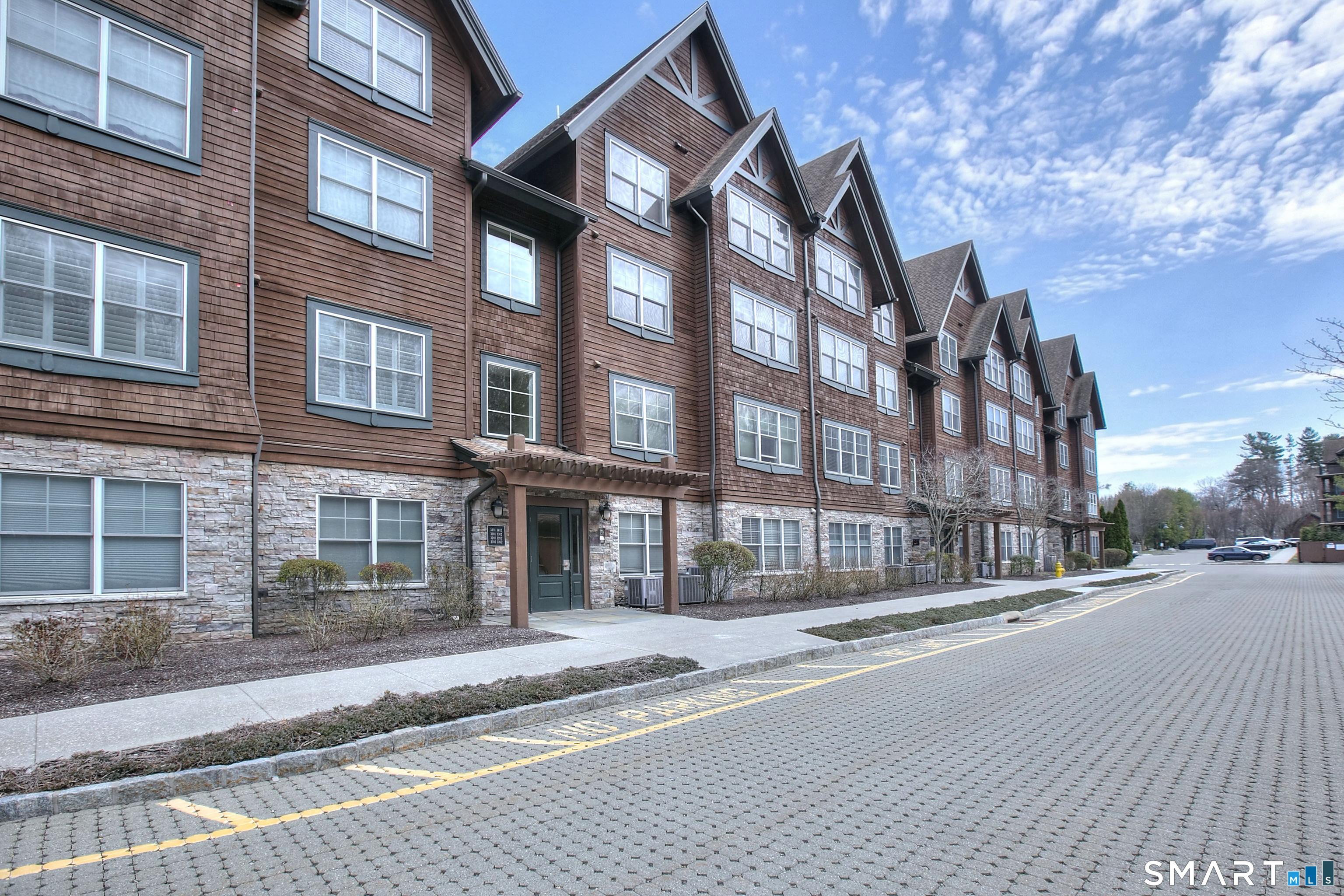 16 Hayestown Road, Unit C402 Danbury, CT 06811 - Photo 2 of 36 a view of a building and a street