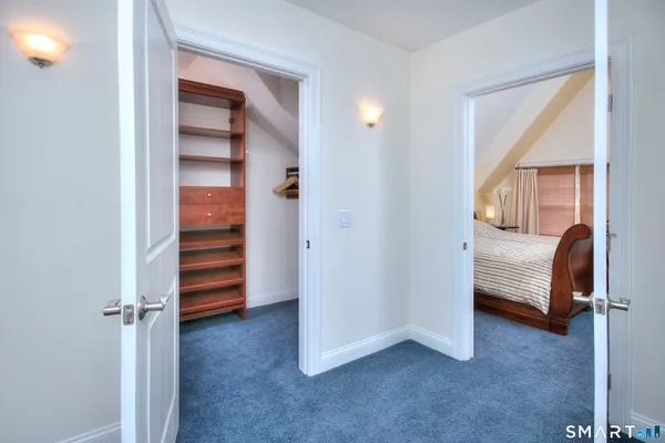 a view of bedroom and bedroom with a closet