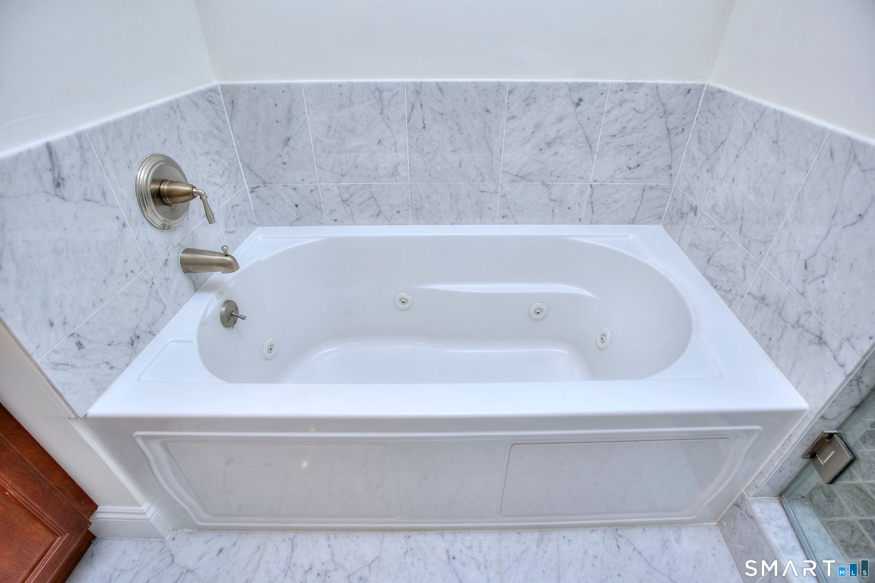 16 Hayestown Road, Unit C402 Danbury, CT 06811 - Photo 26 of 36 a bathroom with a tub