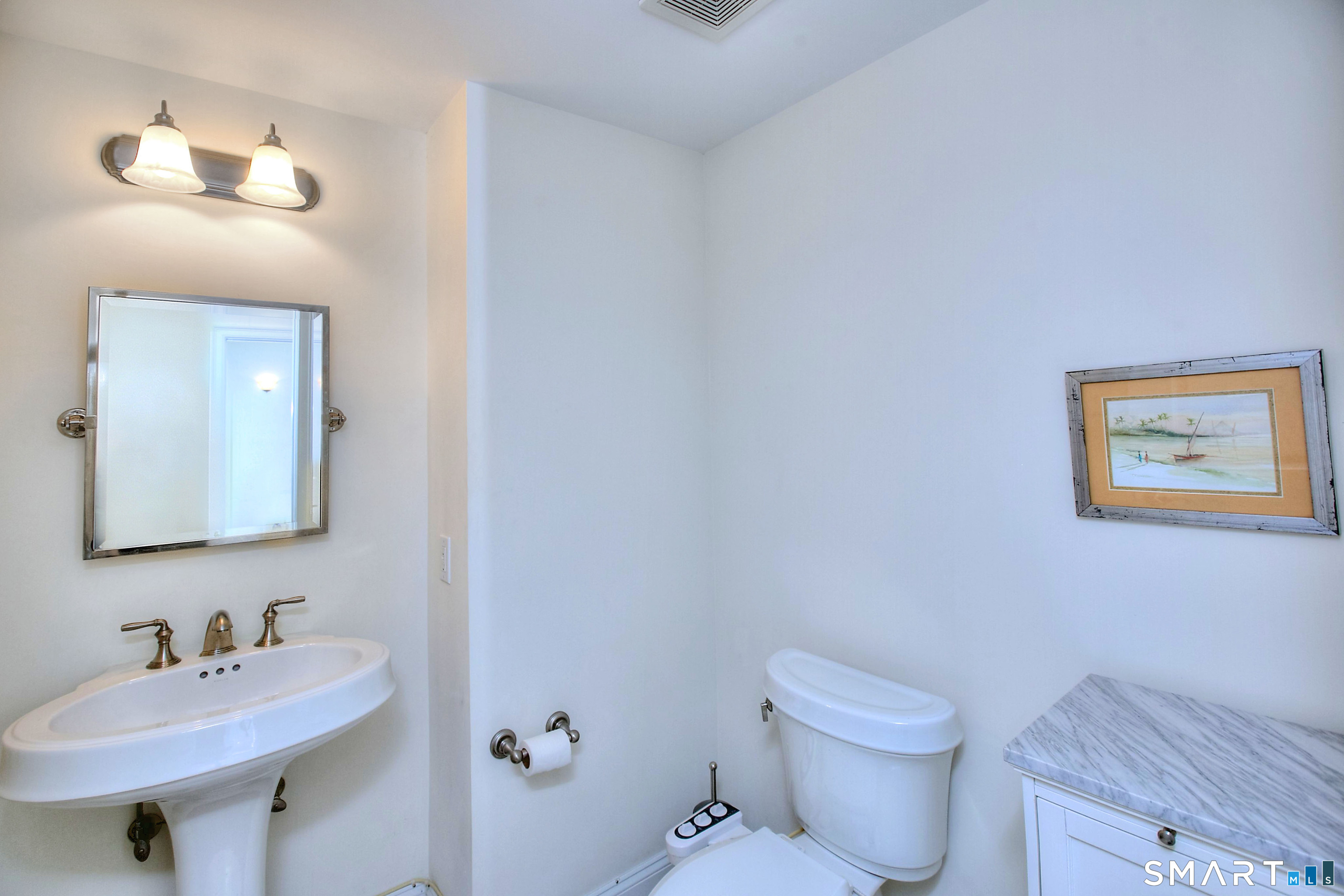 16 Hayestown Road, Unit C402 Danbury, CT 06811 - Photo 29 of 36 a bathroom with a toilet a sink and mirror