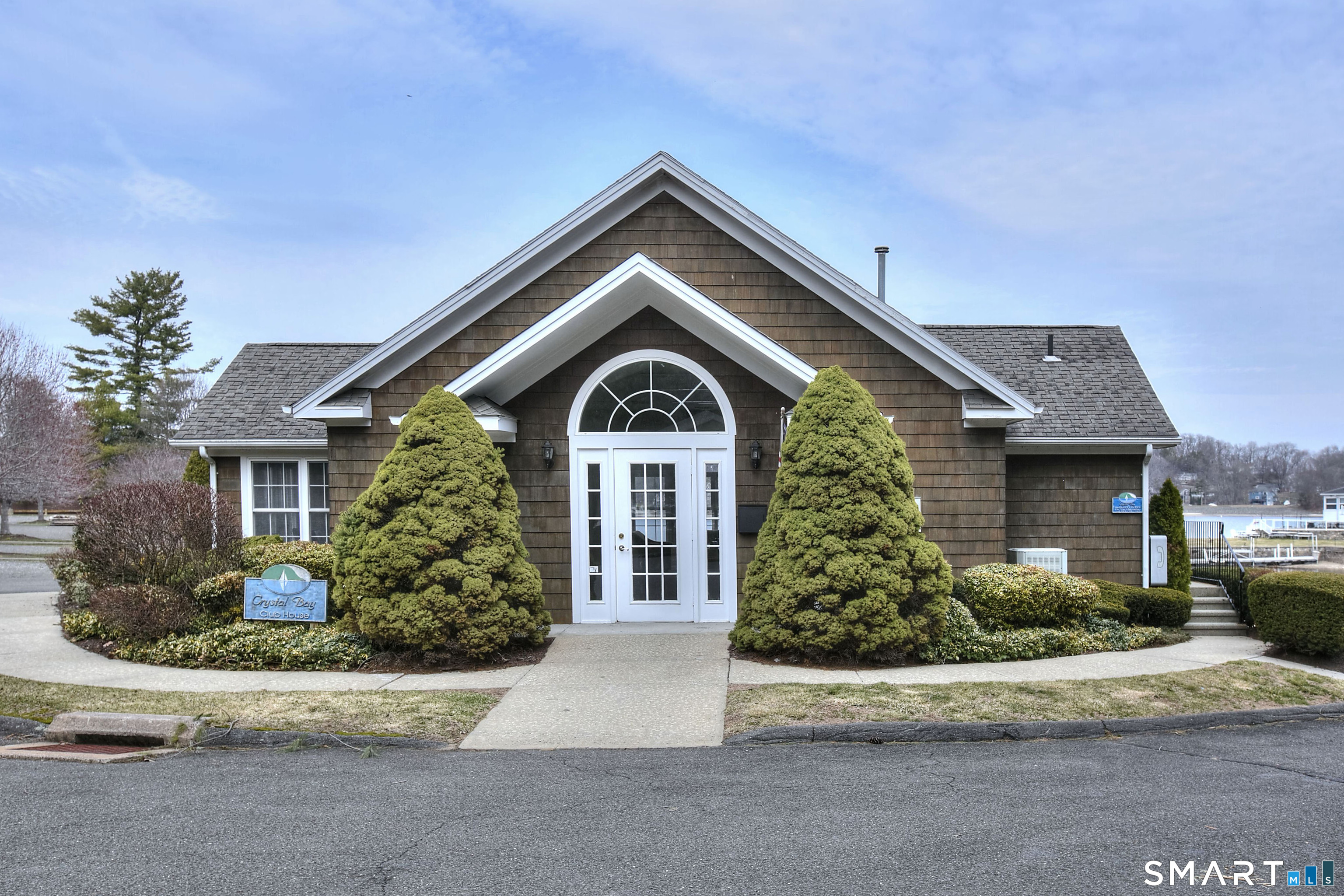 16 Hayestown Road, Unit C402 Danbury, CT 06811 - Photo 33 of 36 a front view of a house with garden