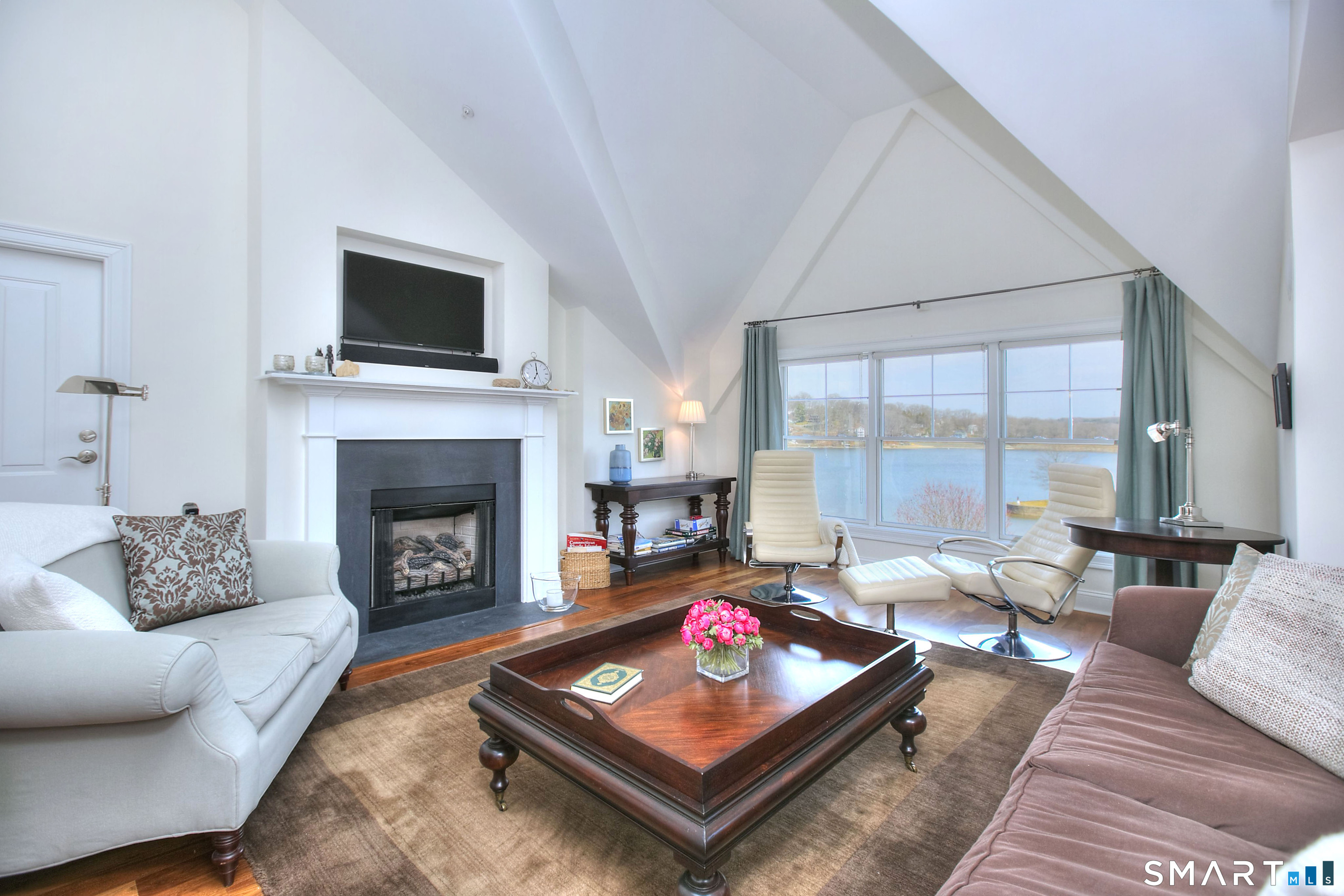 16 Hayestown Road, Unit C402 Danbury, CT 06811 - Photo 6 of 36 a living room with furniture and a fireplace