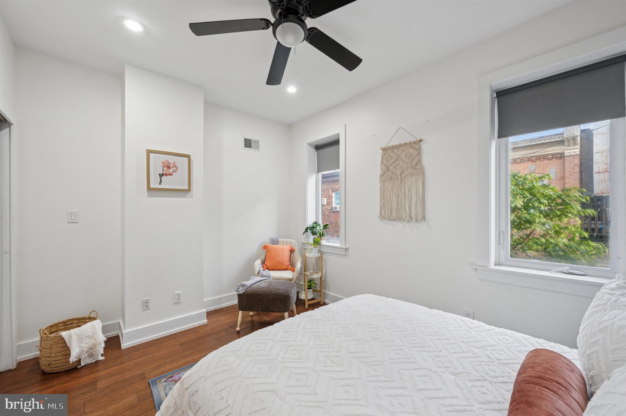637 Cross Street Philadelphia, PA 19147 - Photo 20 of 28 a bedroom with a bed and wooden floor