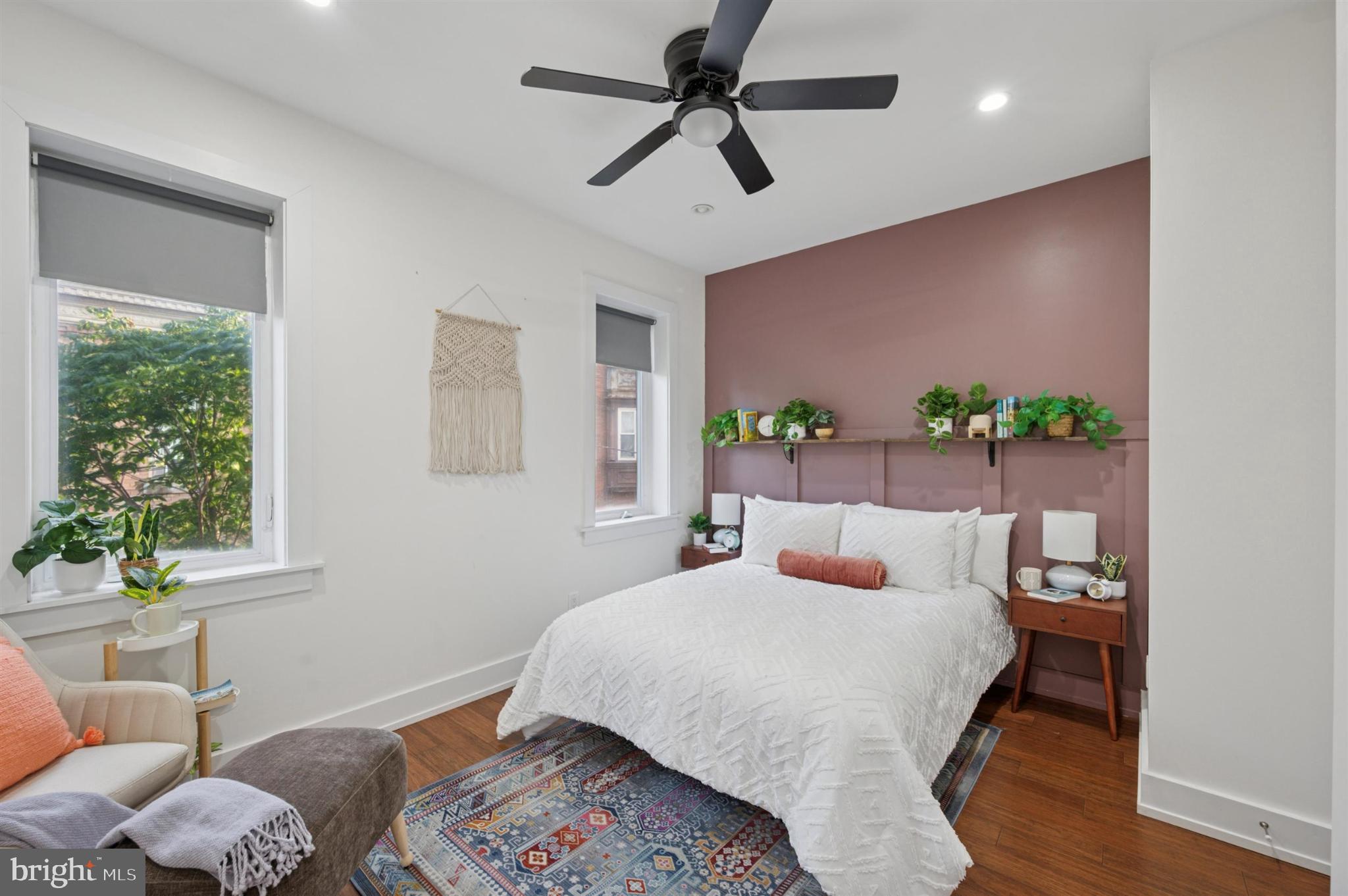 637 Cross Street Philadelphia, PA 19147 - Photo 21 of 28 a bedroom with a bed and wooden floor