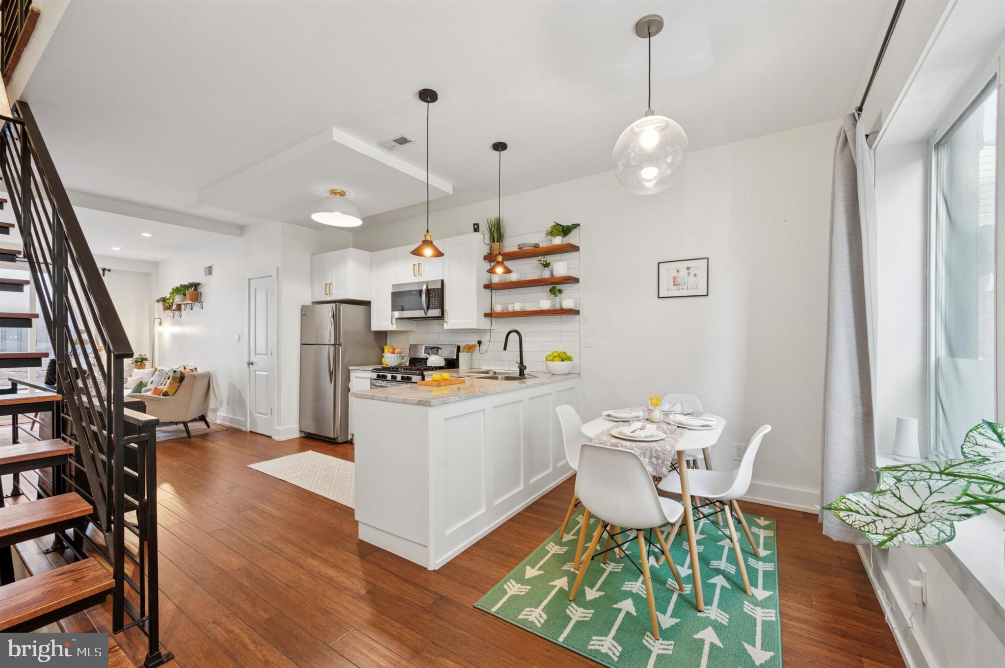 637 Cross Street Philadelphia, PA 19147 - Photo 8 of 28 a living room with furniture and a chandelier