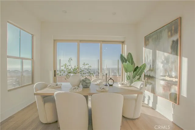 a dining room with furniture and wooden floor