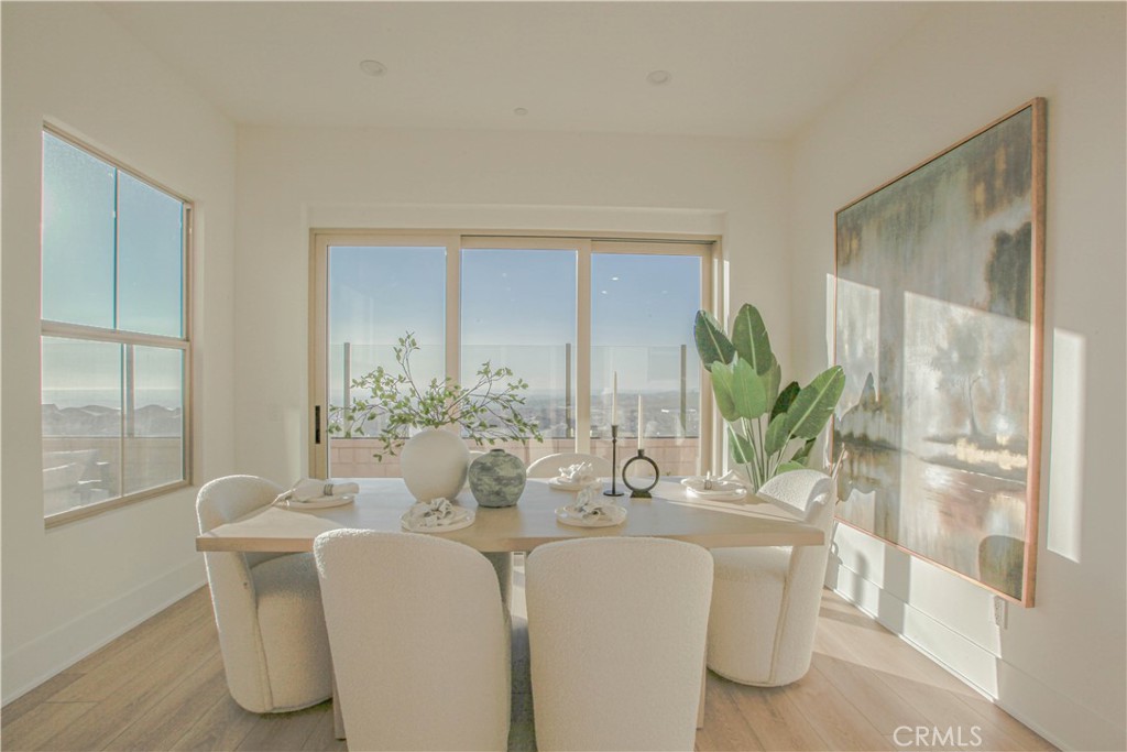 137 Oakstone Irvine, CA 92618 - Photo 16 of 54 a dining room with furniture and wooden floor