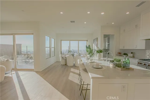 a very nice looking room with a large window and furniture