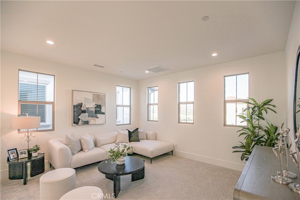 137 Oakstone Irvine, CA 92618 - Photo 24 of 54 a living room with furniture and a potted plant