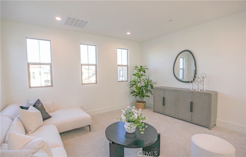 137 Oakstone Irvine, CA 92618 - Photo 25 of 54 a living room with furniture flowerpot and a window