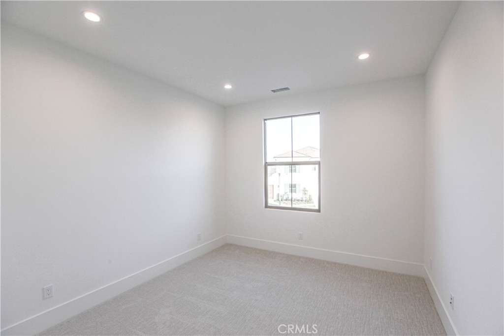 137 Oakstone Irvine, CA 92618 - Photo 27 of 54 an empty room with a window