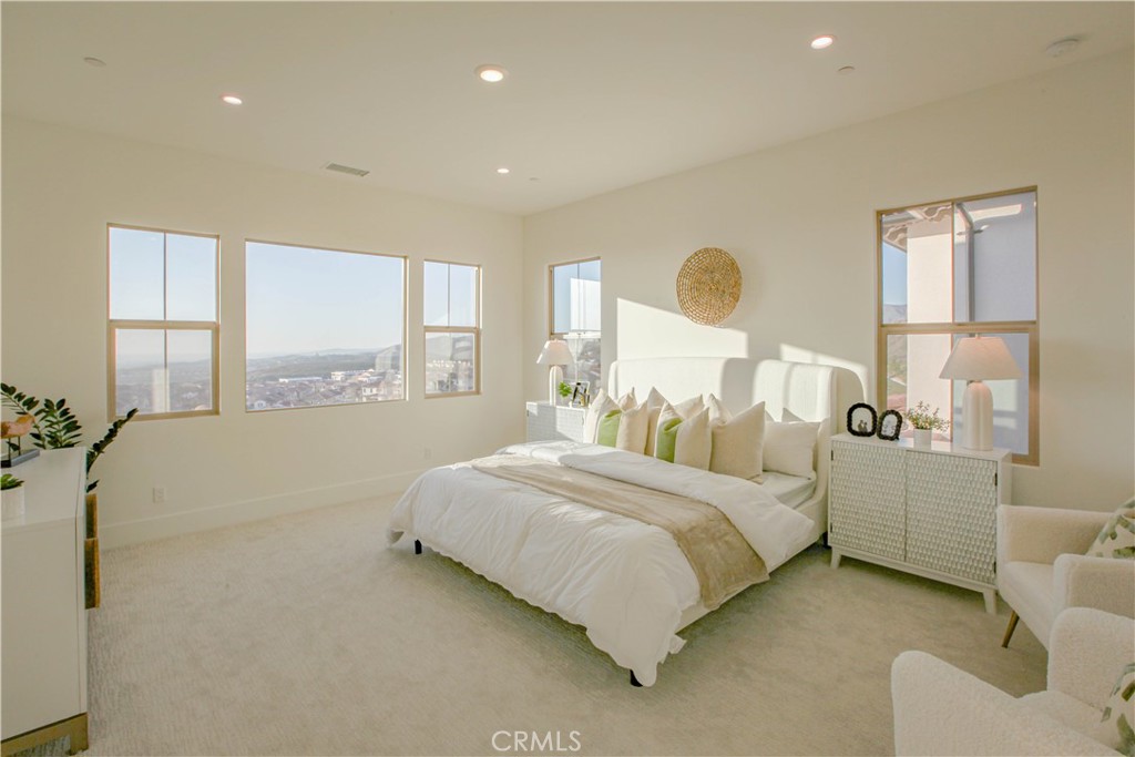 137 Oakstone Irvine, CA 92618 - Photo 28 of 54 a bedroom with a bed and window