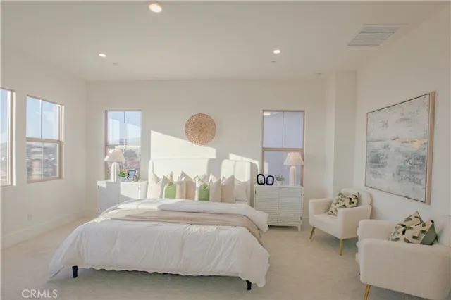 a bedroom with a bed and a cabinets