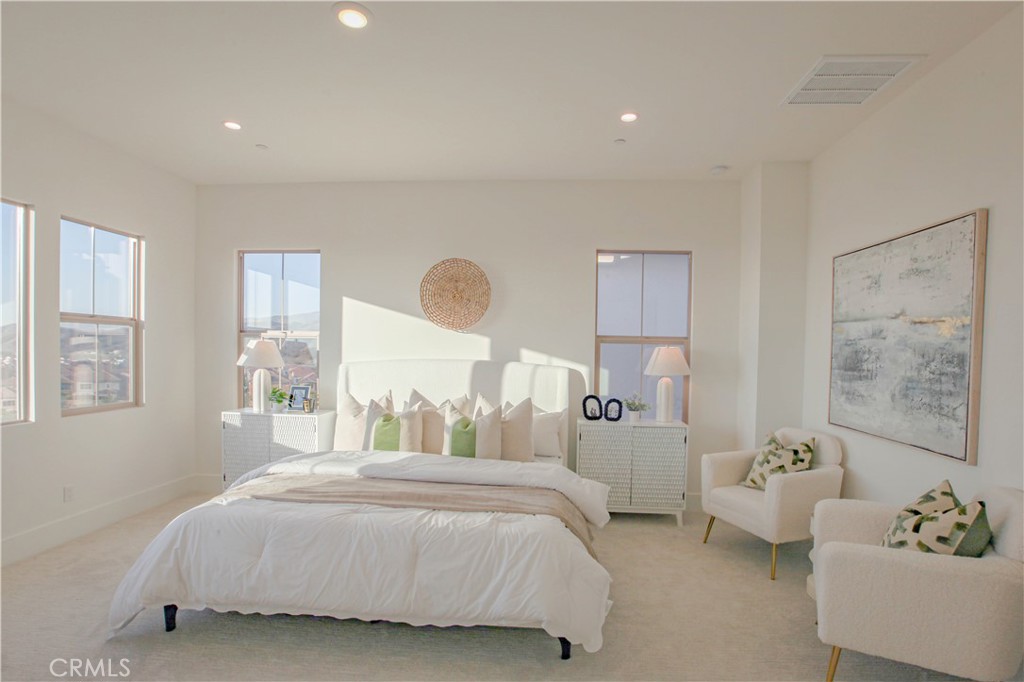 137 Oakstone Irvine, CA 92618 - Photo 29 of 54 a bedroom with a bed couch and window