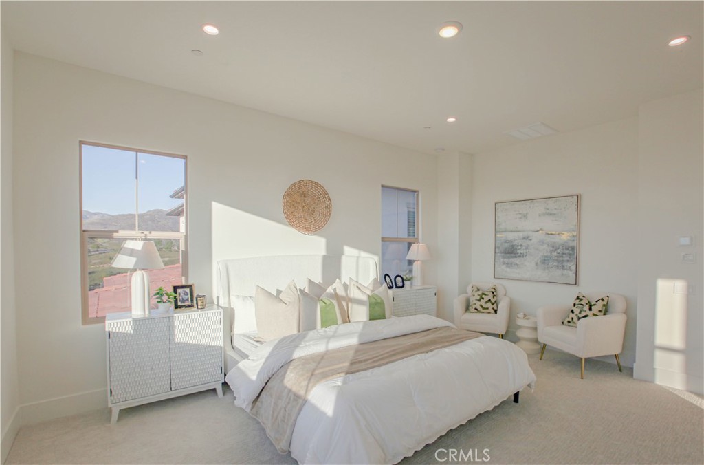 137 Oakstone Irvine, CA 92618 - Photo 30 of 54 a bedroom with a bed and a cabinets