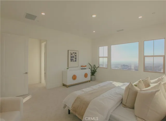 a bathroom with a bathtub sink and window