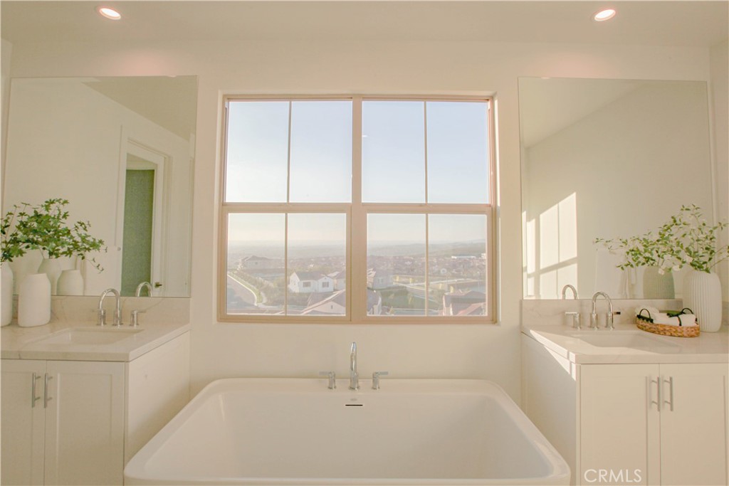 137 Oakstone Irvine, CA 92618 - Photo 32 of 54 a bathroom with a bathtub sink and window