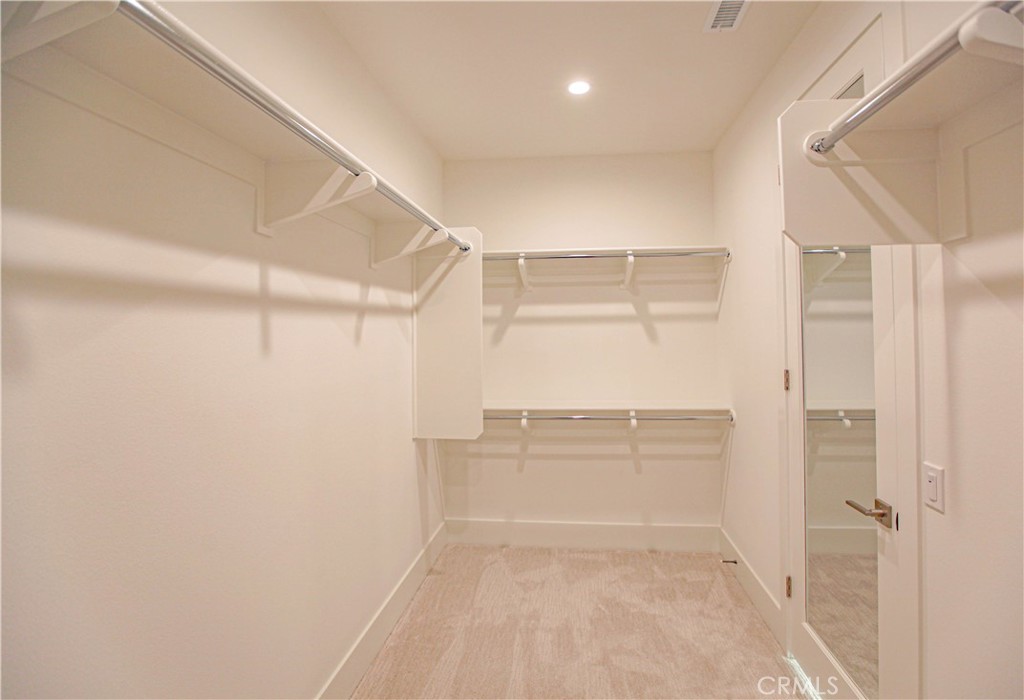 137 Oakstone Irvine, CA 92618 - Photo 34 of 54 a view of a room with racks on the wall
