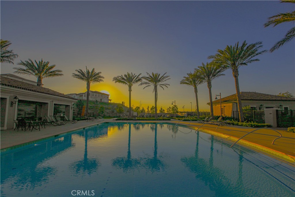 137 Oakstone Irvine, CA 92618 - Photo 39 of 54 a view of swimming pool with outdoor seating and a lake view