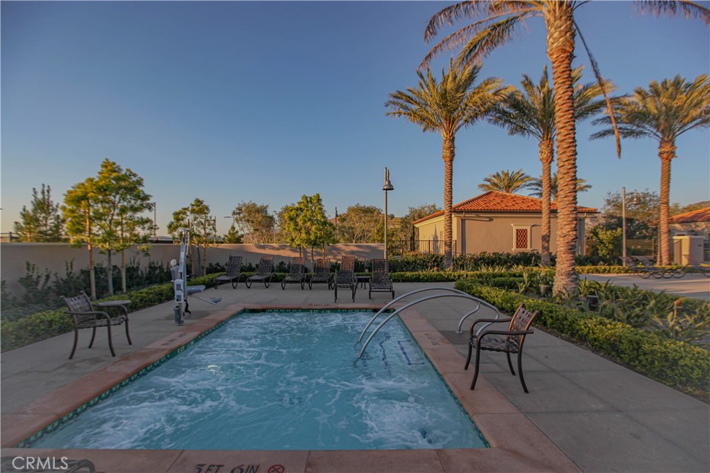 137 Oakstone Irvine, CA 92618 - Photo 40 of 54 a view of a swimming pool with a patio and a yard