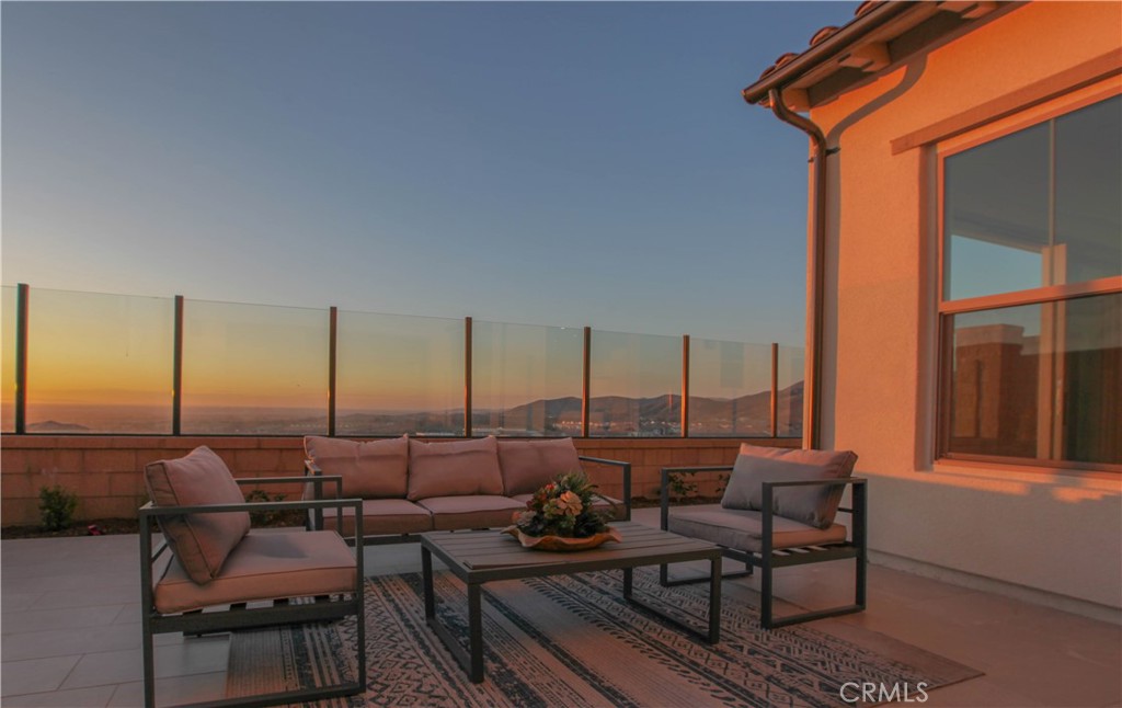 137 Oakstone Irvine, CA 92618 - Photo 4 of 54 a terrace with outdoor seating and water view