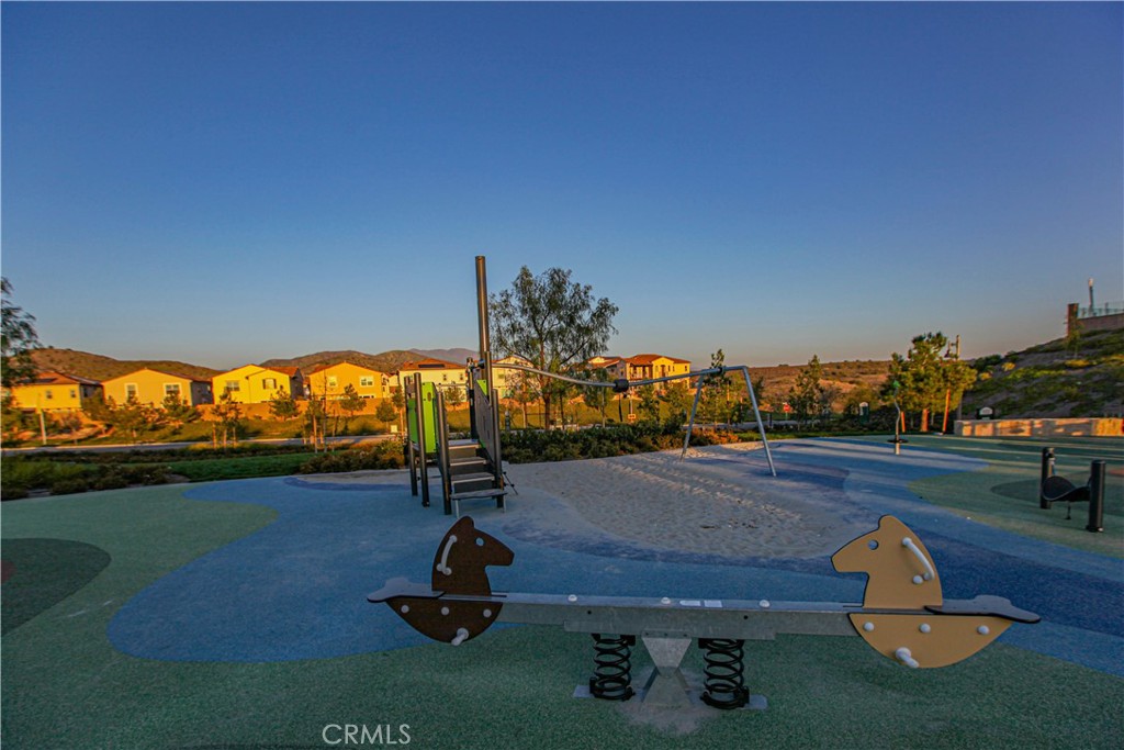137 Oakstone Irvine, CA 92618 - Photo 43 of 54 a view of a swimming pool with a yard
