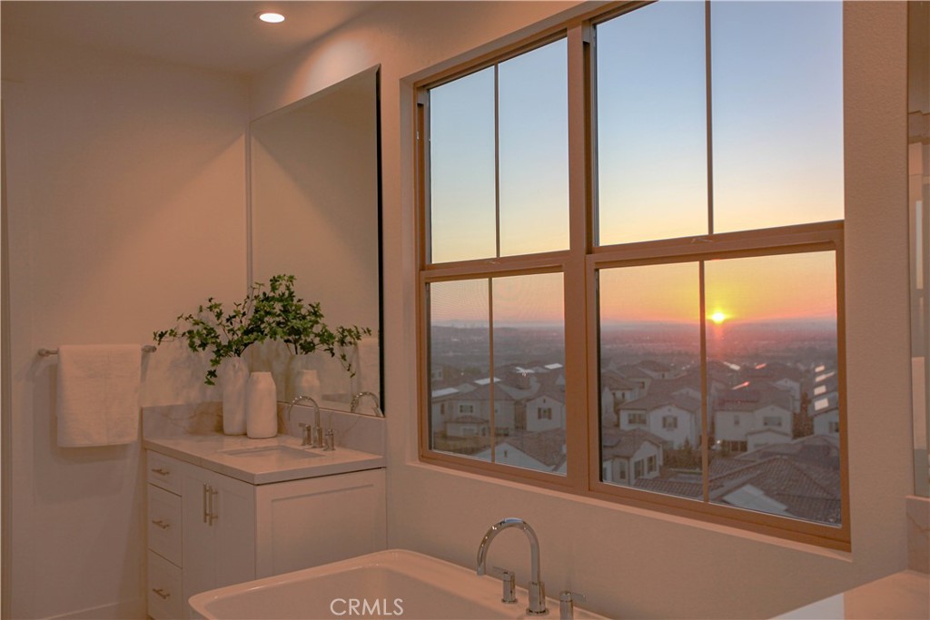 137 Oakstone Irvine, CA 92618 - Photo 53 of 54 a bathroom with a toilet a sink and a window