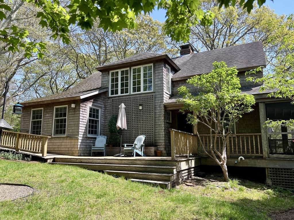 225 Lamberts Cove Road West Tisbury, MA 02568 - Photo 31 of 33 a front view of a house with a yard