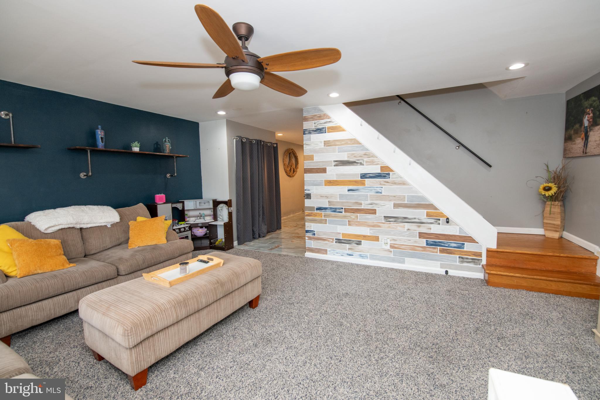 12506 Chilton Road Philadelphia, PA 19154 - Photo 12 of 55 a living room with furniture and a chandelier