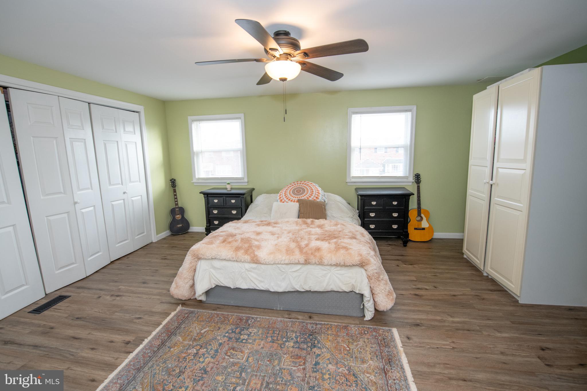 12506 Chilton Road Philadelphia, PA 19154 - Photo 23 of 55 a spacious bedroom with a bed and a chandelier