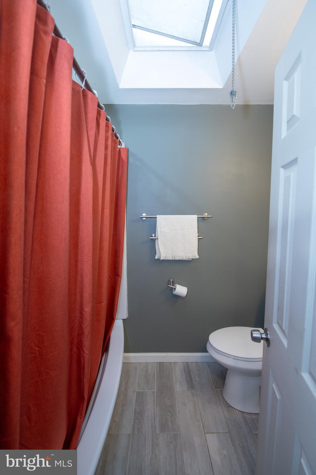 12506 Chilton Road Philadelphia, PA 19154 - Photo 29 of 55 a bathroom with a toilet and a shower curtain