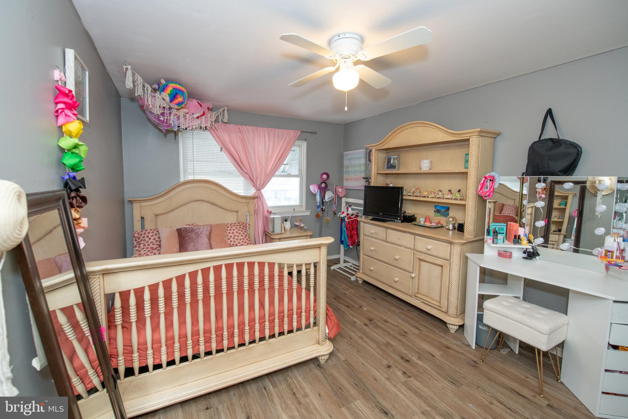 12506 Chilton Road Philadelphia, PA 19154 - Photo 36 of 55 a kitchen that has a lot of cabinets a sink dishwasher and a dining table with wooden floor