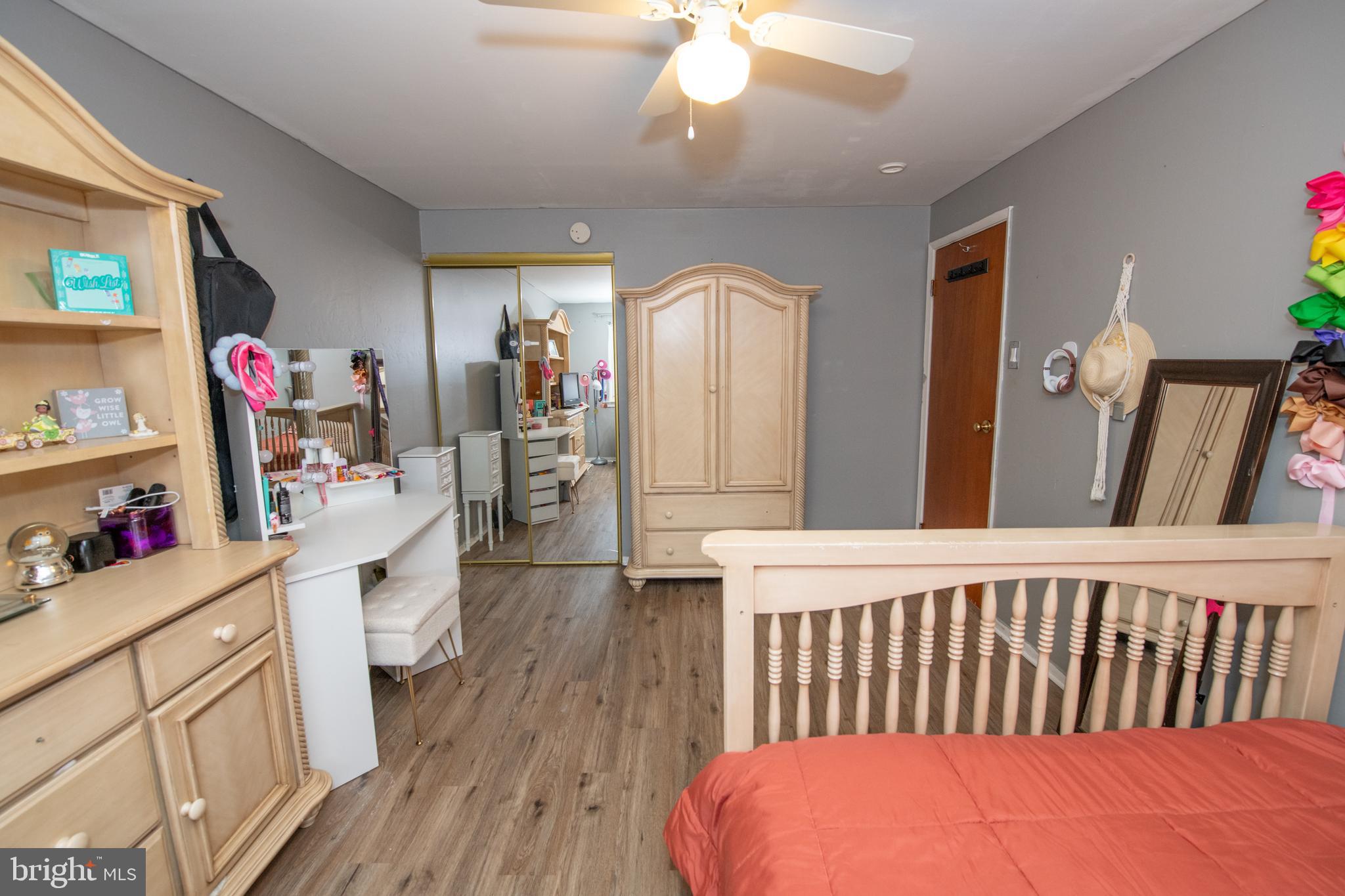 12506 Chilton Road Philadelphia, PA 19154 - Photo 37 of 55 a bedroom with a bed and wooden floor