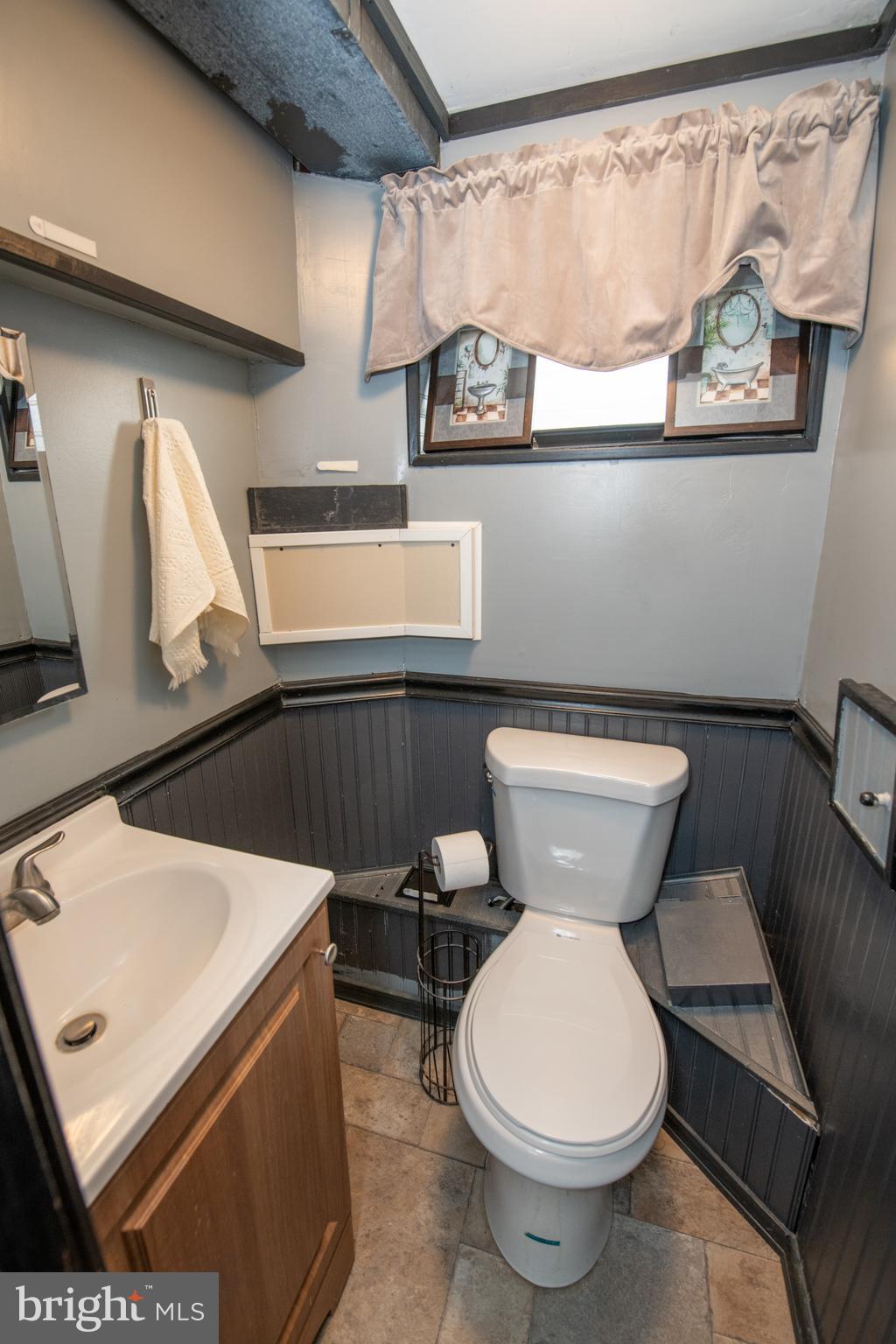 12506 Chilton Road Philadelphia, PA 19154 - Photo 43 of 55 a bathroom with a toilet sink and mirror