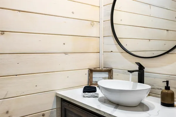 a bathroom with a sink and a mirror
