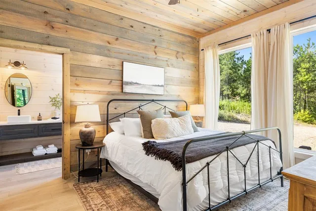 a kitchen with granite countertop a table chairs stove and cabinets