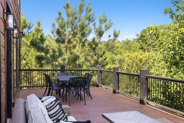 a view of a balcony with furniture