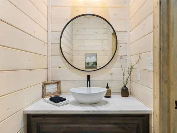 a bathroom with a sink and a mirror