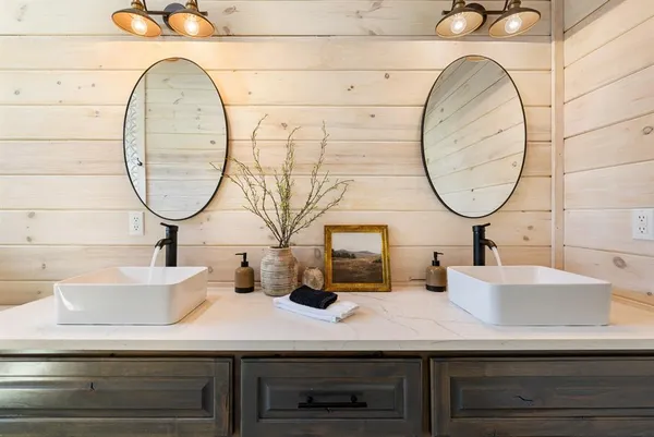 a bathroom with a sink and a mirror