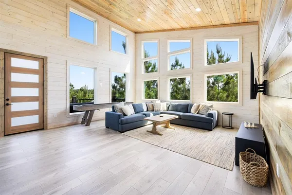 a living room with furniture and a window
