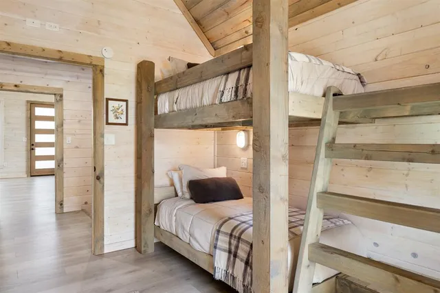a bathroom with a double vanity sink mirror and toilet
