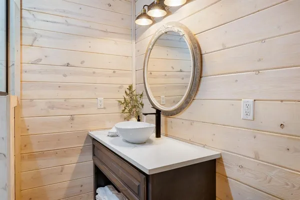 a room with a sink and a mirror