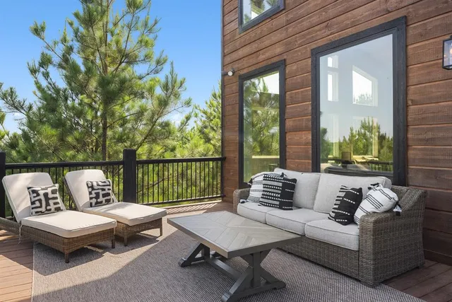 a outdoor living room with furniture and a window
