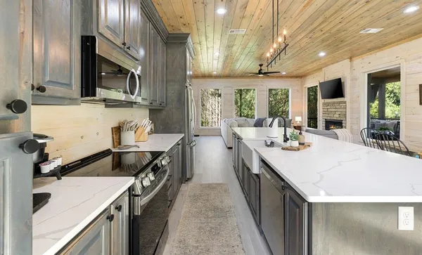 a kitchen with a sink stove and cabinets