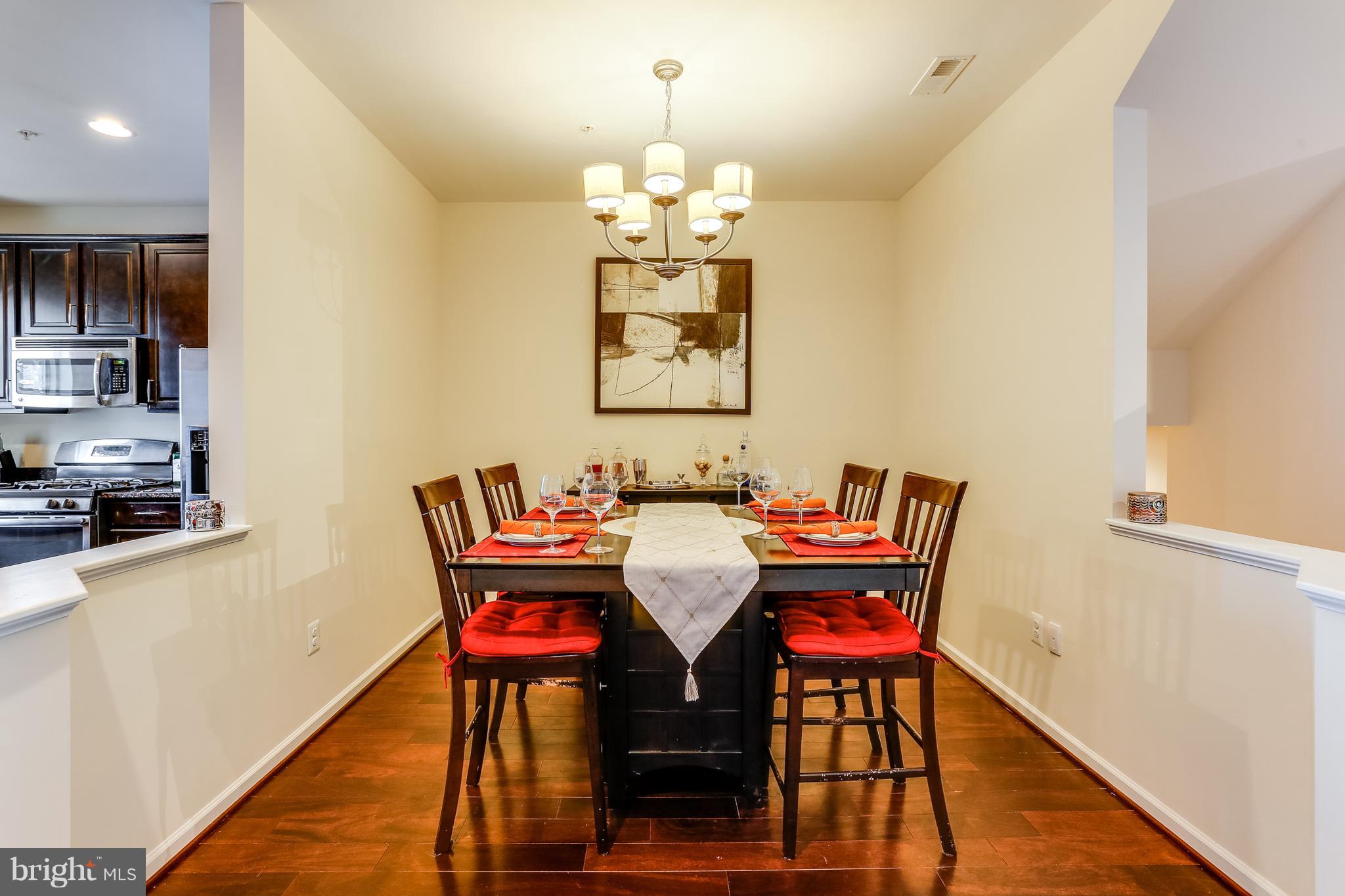 1109 Red Hawk Way Severn, MD 21144 - Photo 11 of 29 a view of a dining room with furniture and wooden floor