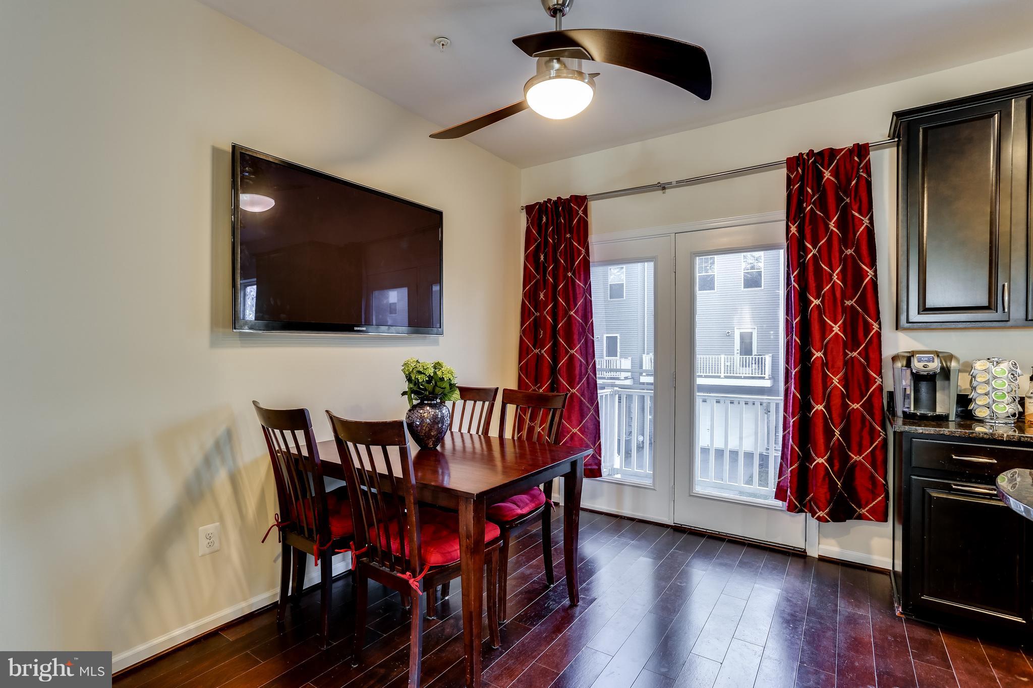 1109 Red Hawk Way Severn, MD 21144 - Photo 13 of 29 a view of a dining room with furniture and wooden floor