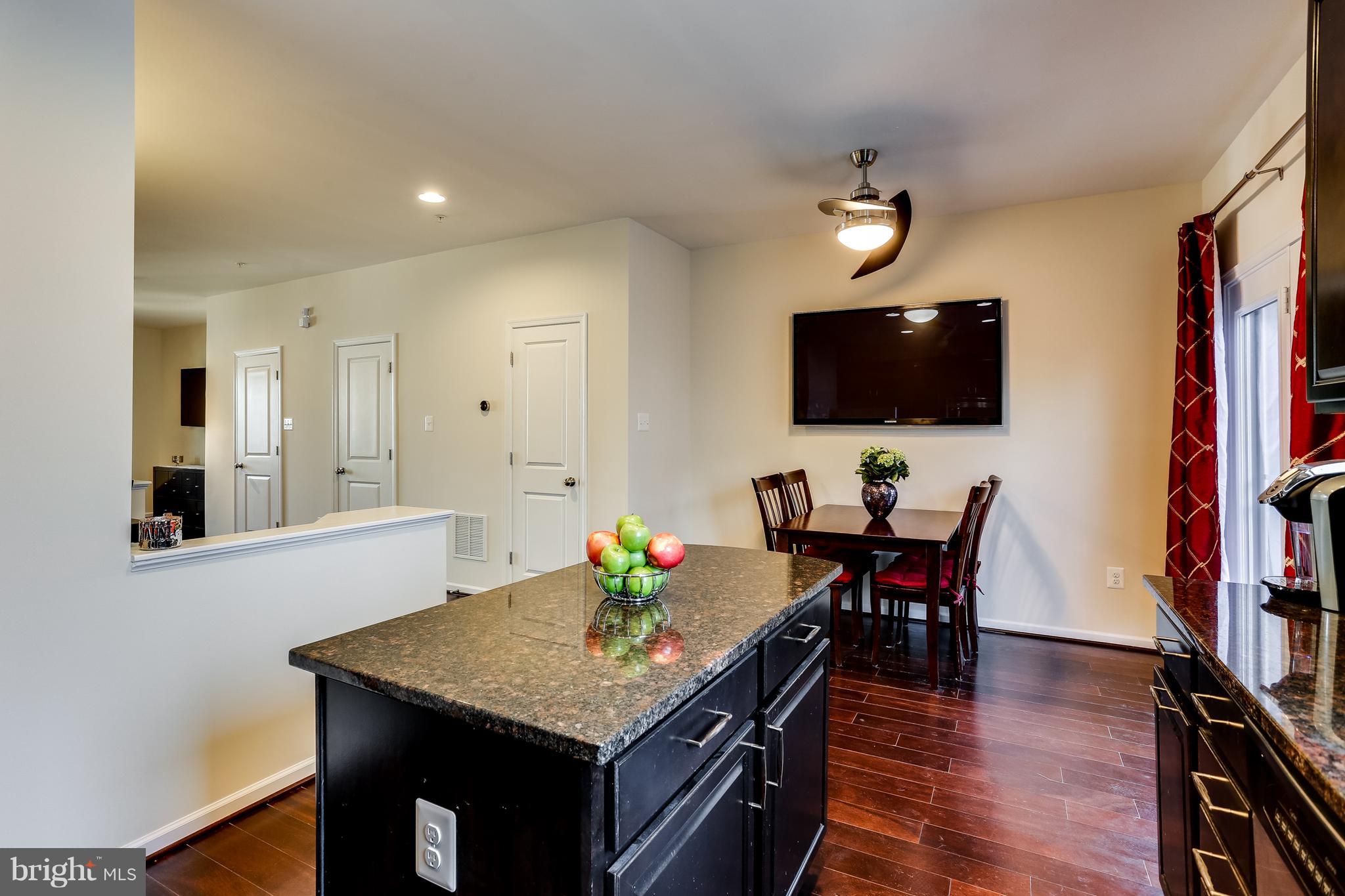 1109 Red Hawk Way Severn, MD 21144 - Photo 17 of 29 a view of a dining room with furniture and wooden floor